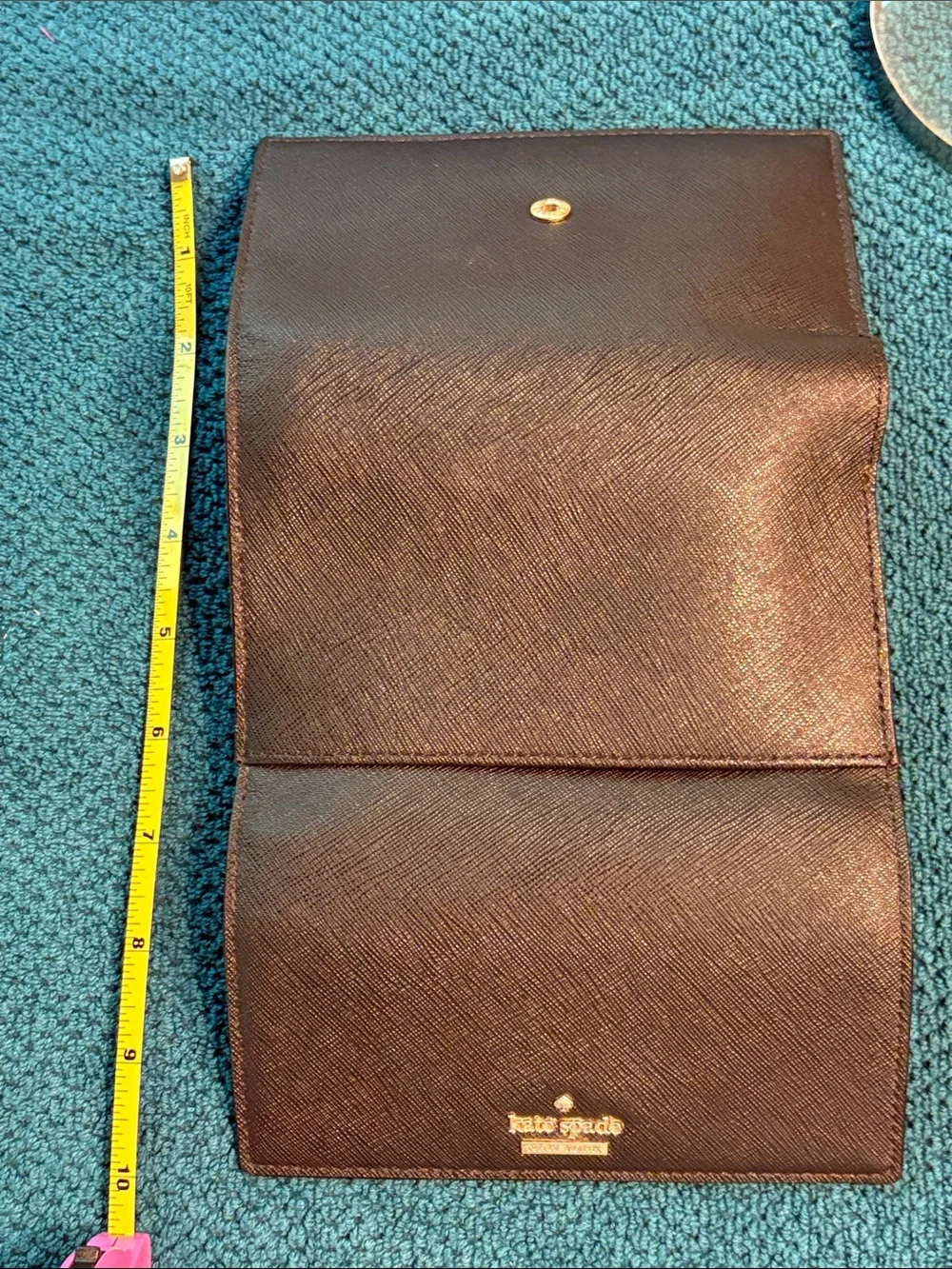 Kate Spade black saffiano tri-fold hand wallet with gold logo